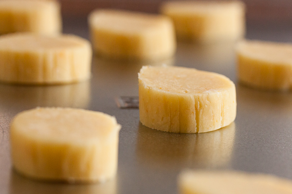 unbaked cookie dough slices on cookie sheet