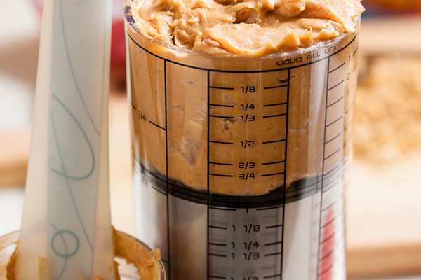 peanut butter in plunger measuring cup