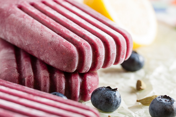 Blueberry Cardamom Popsicles combine fresh summer berries with aromatic cardamom for a complex and sophisticated flavour.