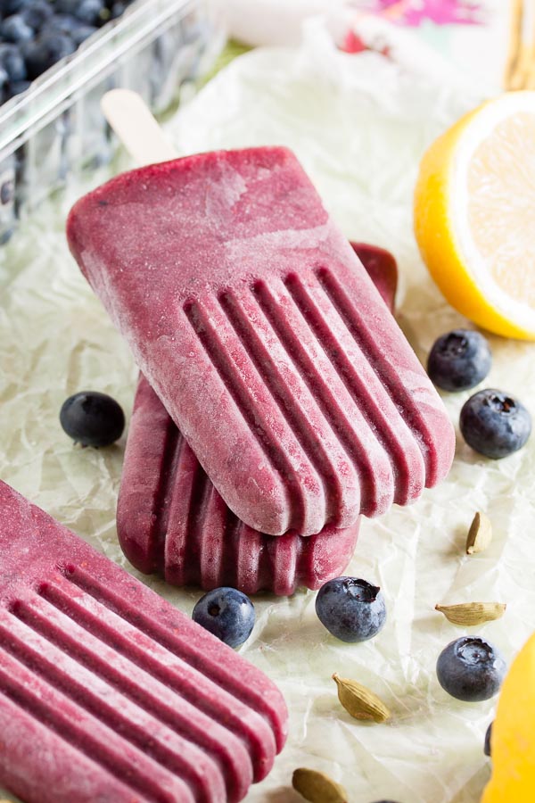 Blueberry Cardamom Popsicles combine fresh summer berries with aromatic cardamom for a complex and sophisticated flavour.