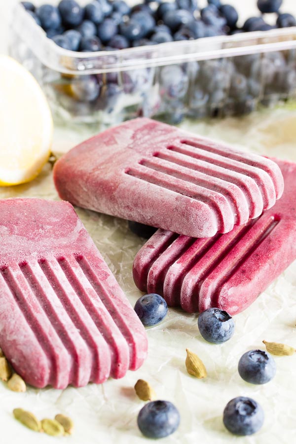 Blueberry Cardamom Popsicles combine fresh summer berries with aromatic cardamom for a complex and sophisticated flavour.