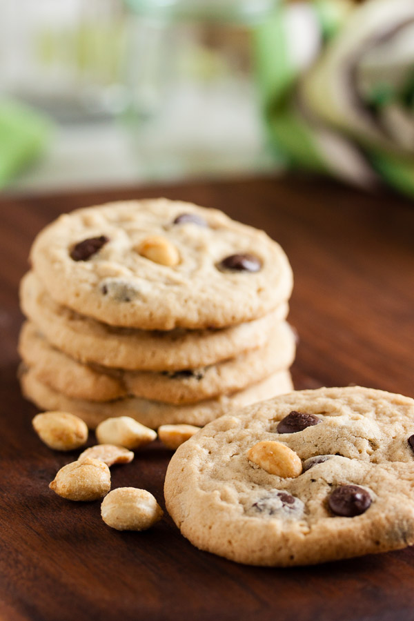 Peanut Butter Chocolate Chip Cookies – soft and chewy, loaded with chocolate chips, and topped with a salted peanut to contrast the sweetness.