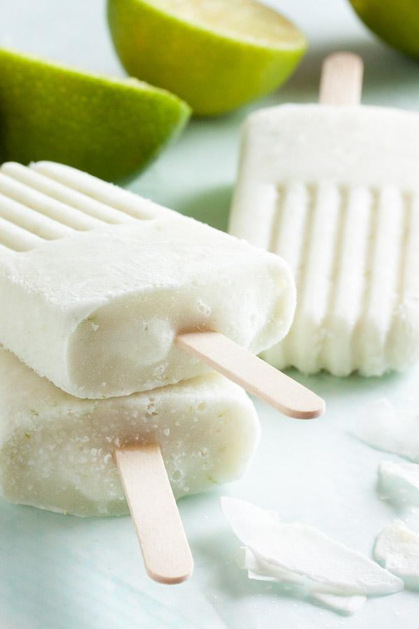 These coconut lime popsicles are creamy, delicious, and so refreshing for a hot summer day. Not to mention super easy to make.
