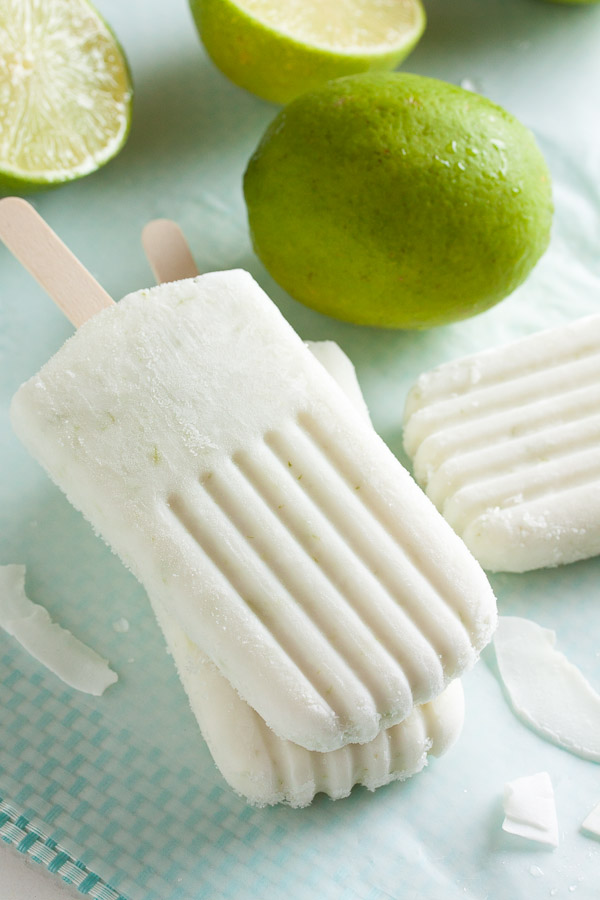 These coconut lime popsicles are creamy, delicious, and so refreshing for a hot summer day. Not to mention super easy to make.