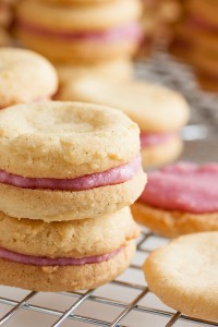 These Raspberry Cream Sandwich Cookies combine a delicate vanilla cookie with a sweet cream filling made with real raspberries.