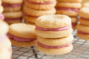 These Raspberry Cream Sandwich Cookies combine a delicate vanilla cookie with a sweet cream filling made with real raspberries.