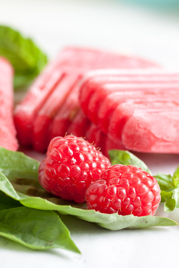 Raspberry Basil Popsicles. All the lovely tart, sweet flavour of raspberries, cut slightly by spicy, earthy basil.