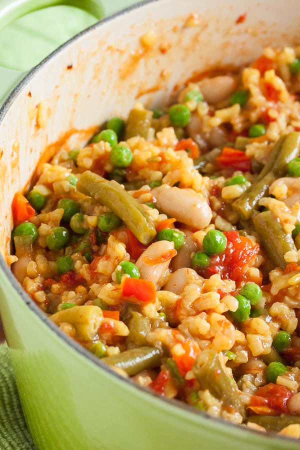 Brightly coloured vegetarian paella – a delicious and filling blend of rice, vegetables, and legumes.