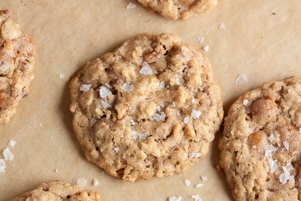 Oatmeal Salted Caramel Cookies – a perfectly chewy cookie, studded with crunchy pecans, lots of sweet caramel bits, and topped with a generous sprinkling of flaked sea salt.