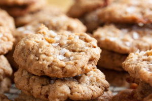 Oatmeal Salted Caramel Cookies – a perfectly chewy cookie, studded with lots sweet caramel bits, and topped with a generous sprinkling of flaked sea salt.