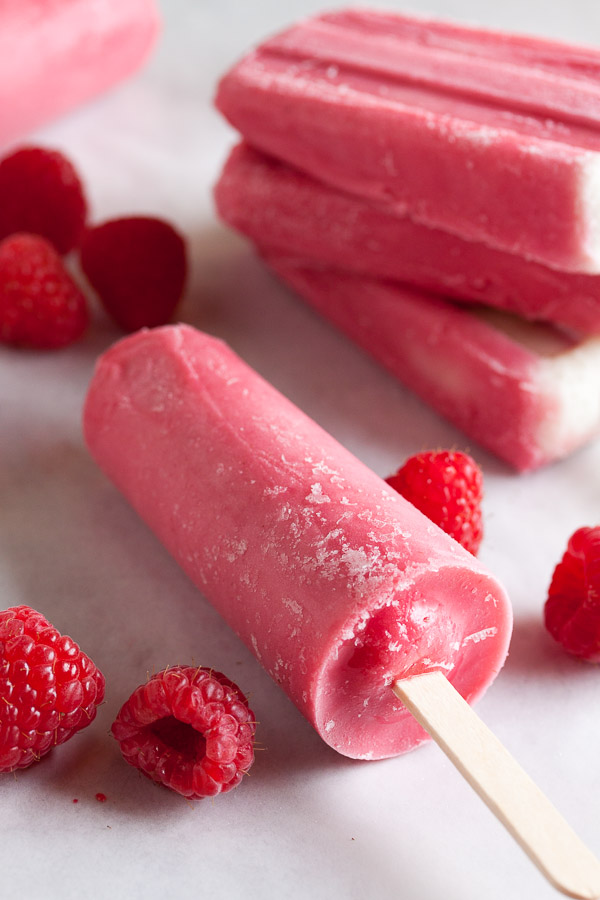 Raspberry Sherbet Popsicles, made with lots of plump juicy raspberries, fresh from the farmer's market. A great way to prolong the fresh flavours of summer!