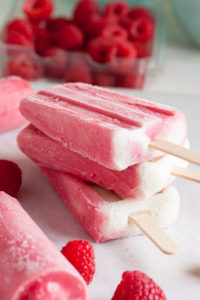 Raspberry Sherbet Popsicles, made with lots of plump juicy raspberries, fresh from the farmer's market. A great way to prolong the fresh flavours of summer!