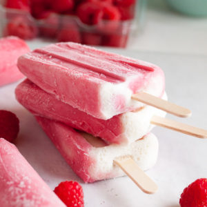 Raspberry Sherbet Popsicles, made with lots of plump juicy raspberries, fresh from the farmer's market. A great way to prolong the fresh flavours of summer!