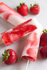 Strawberry-Swirl Vanilla Yogurt Popsicles – creamy vanilla yogurt and swirls of fresh strawberry purée, with all the bright fresh flavour you'd expect.