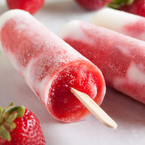 Strawberry-Swirl Vanilla Yogurt Popsicles – creamy vanilla yogurt and swirls of fresh strawberry purée, with all the bright fresh flavour you'd expect.