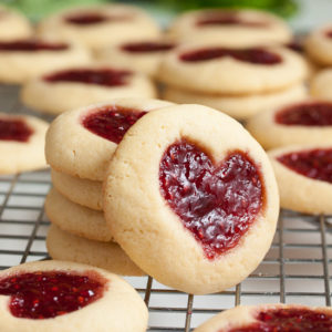 Perfectly soft and buttery little heart-shaped jam thumbprint cookies.