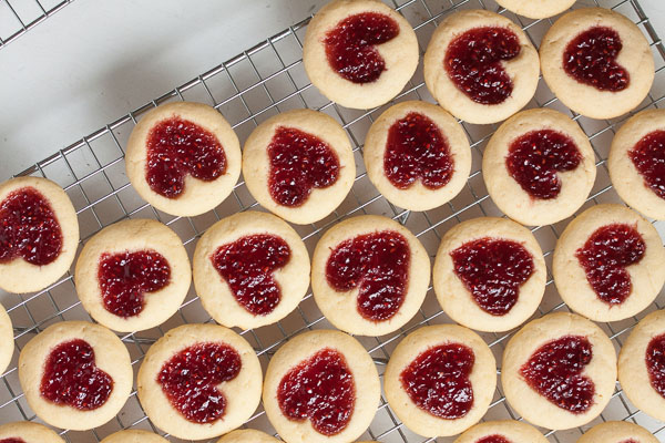 Perfectly soft and buttery little heart-shaped jam thumbprint cookies.