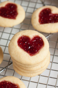 Perfectly soft and buttery little heart-shaped jam thumbprint cookies.