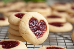 Perfectly soft and buttery little heart-shaped jam thumbprint cookies.