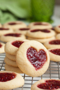 Perfectly soft and buttery little heart-shaped jam thumbprint cookies.