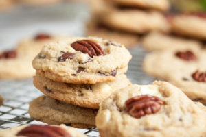 Triple Chocolate Pecan Cookies – soft and chewy, loaded with milk, white, and dark chocolate chips, and topped by a crunchy toasted pecan.