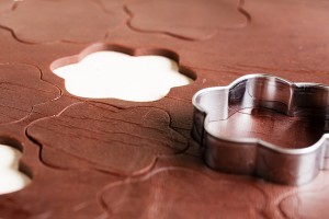 chocolate cookie cutouts dough and cookie cutter