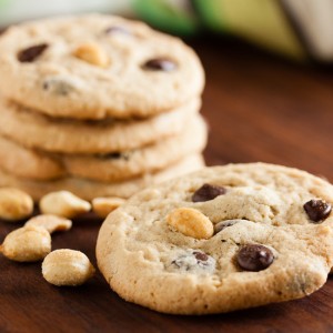 Peanut Butter Chocolate Chip Cookies – soft and chewy, loaded with chocolate chips, and topped with a salted peanut to contrast the sweetness.